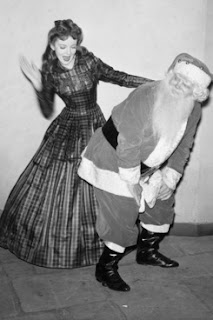 Professional Disciplinarian woman spanking Santa