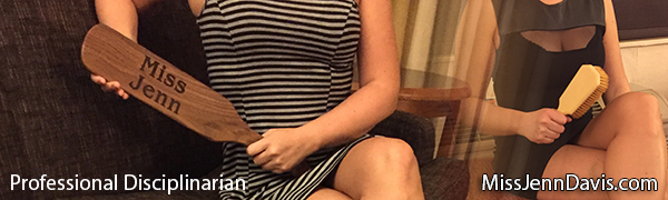 Seattle spanker holding a hairbrush and paddle