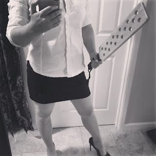 Miss Jenn Davis holding spencer paddle