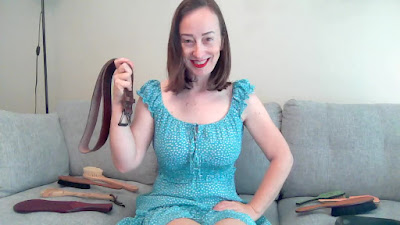 Miss Jenn Davis holding a belt