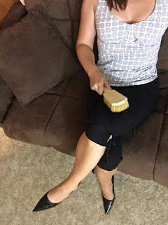 Professional Disciplinarian holds hairbrush for spanking